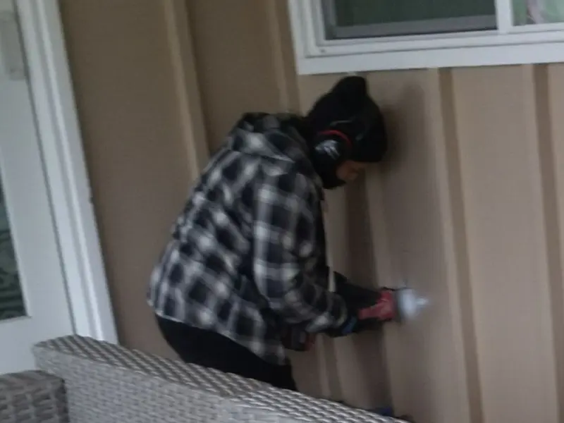 Professional electrician installing an exterior outlet in Covington
